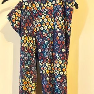 Lularoe TC leggings. Navy with Easter egg type print. Slight wear in thigh.